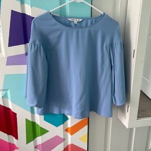 a cute formal sky blue top with bell sleeves